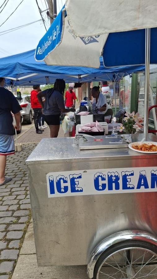 An ice cream cart and supply tables at the Garden Valley relief drive.