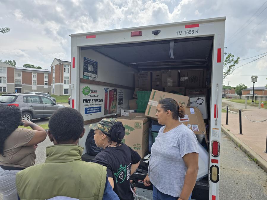 Volunteers loading donated supplies at the truck.